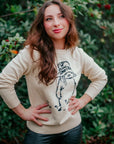 Woman in ivory Paddington Bear sweater