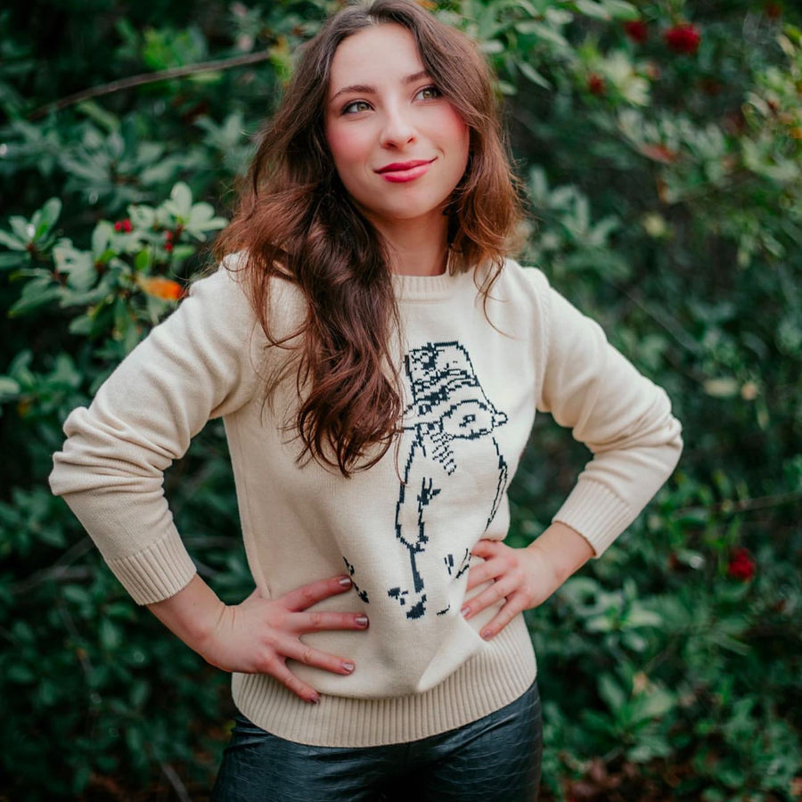 Woman in ivory Paddington Bear sweater