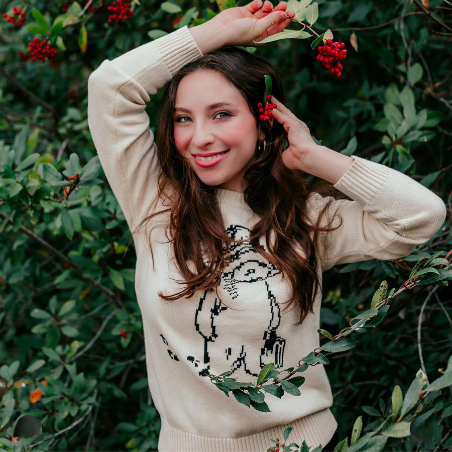 Woman in ivory Paddington Bear sweater