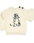 ivory knit sweater with black Paddington Bear design