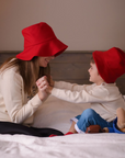 playful cozy time wearing Paddington sweatshirt and hat