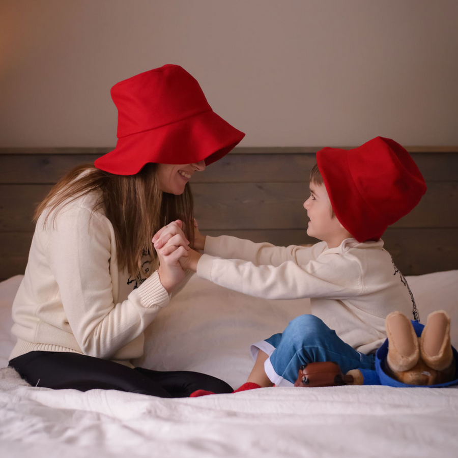 playful cozy time wearing Paddington sweatshirt and hat