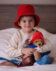 kids in Paddington red hat and soft toy