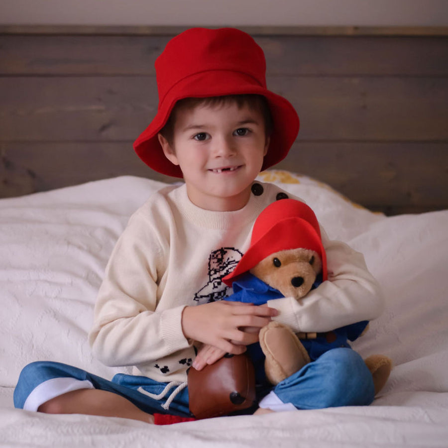 kids in Paddington red hat and soft toy