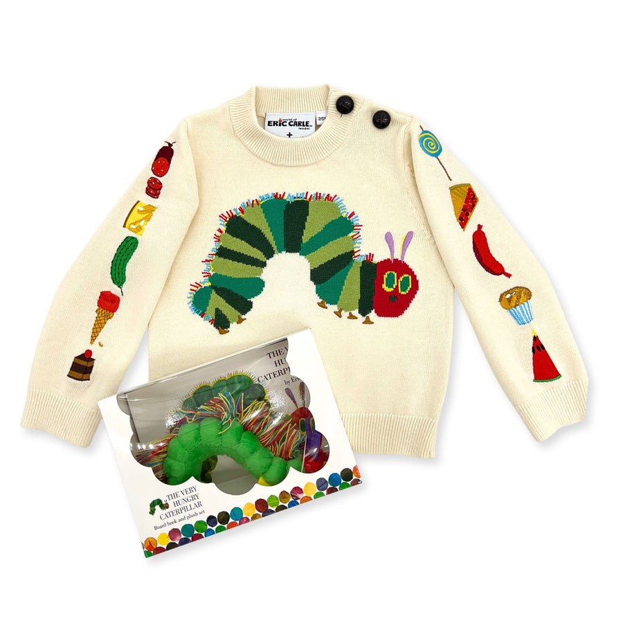 An ivory sweater with The Very Hungry Caterpillar design and food illustrations, alongside a book and plush set