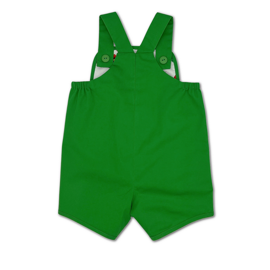 Back view of a green baby romper with adjustable straps and elastic sides