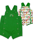 Reversible baby romper with a green side featuring buttons and an embroidered caterpillar, and a white side with colorful food prints