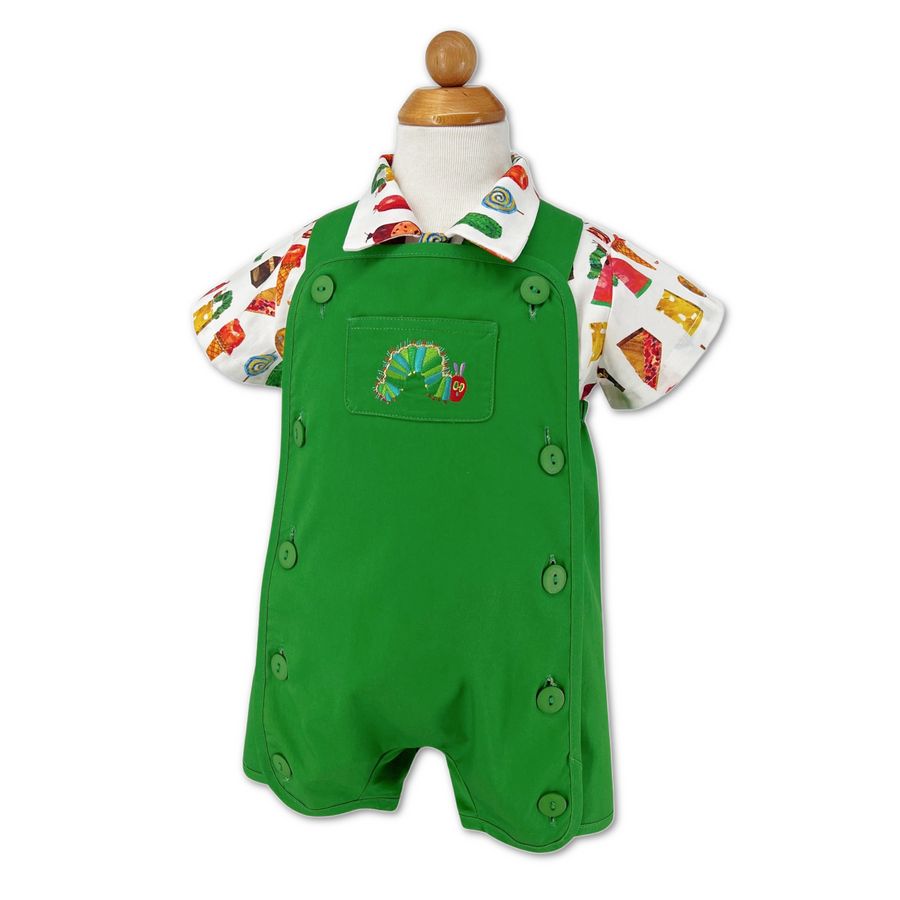 Green baby romper with a "Very Hungry Caterpillar" embroidery on the front pocket, paired with a colorful food-themed short-sleeve shirt, displayed on a mannequin