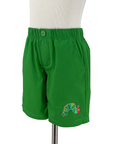 children's green shorts  featuring an elastic waistband with a button closure and an embroidered design of a colorful caterpillar on the lower left leg