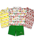 Three short-sleeve button-up shirts with vibrant fruit and food prints (lemons, mixed treats, and strawberries), paired with green shorts featuring a "Very Hungry Caterpillar" embroidery