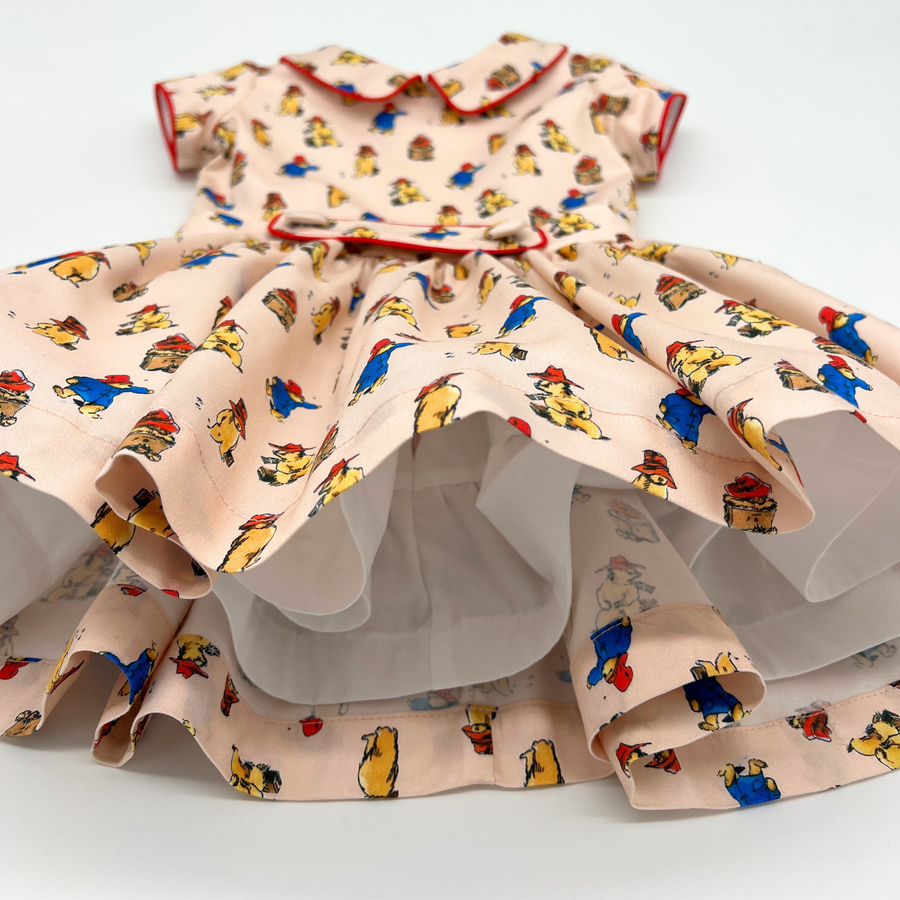 Paddington Bear print dress with red piping and layered petticoat