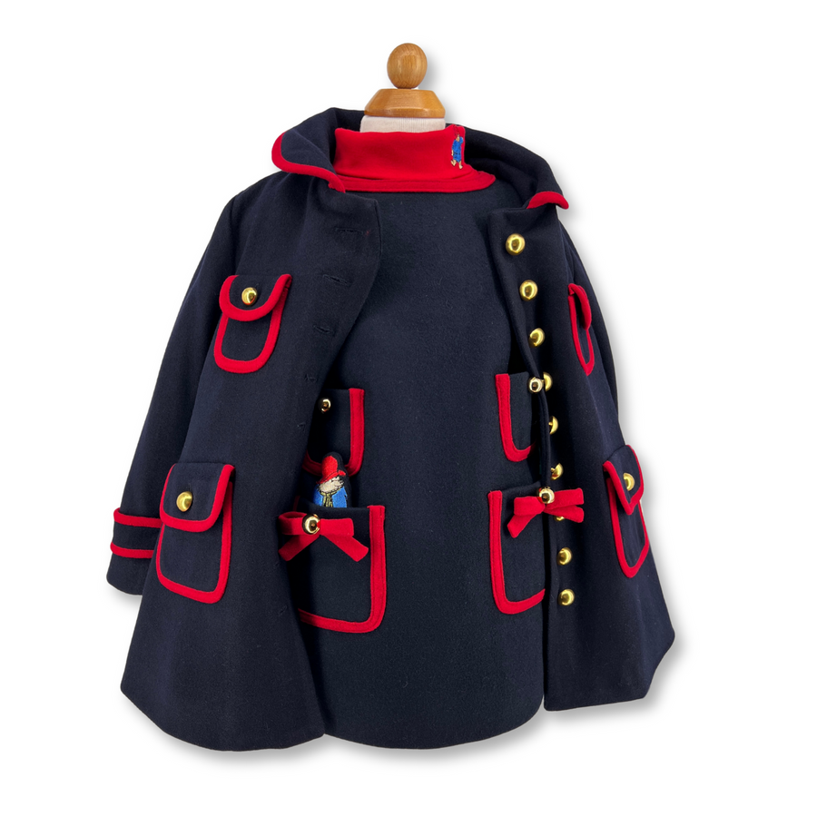 A winter dress and coat set with red trim, gold buttons, front pockets, embroidered with Paddington bear.