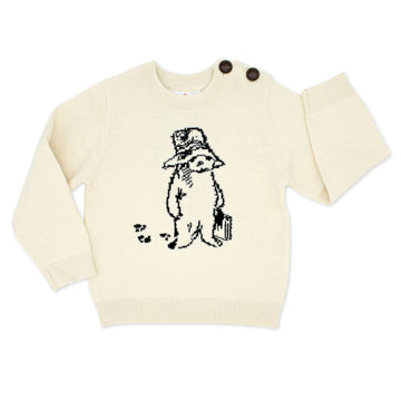 Ivory cotton knit Paddington Bear sweater for kids featuring classic Peggy Fortnum illustration on the front. Unisex and machine washable.