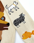 Detailed embroidery of animals on the sleeve of a soft knit children’s sweater