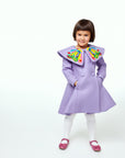 Girls' purple coat inspired by The Very Hungry Caterpillar, featuring a butterfly collar, double-breasted buttons, and a flared silhouette.