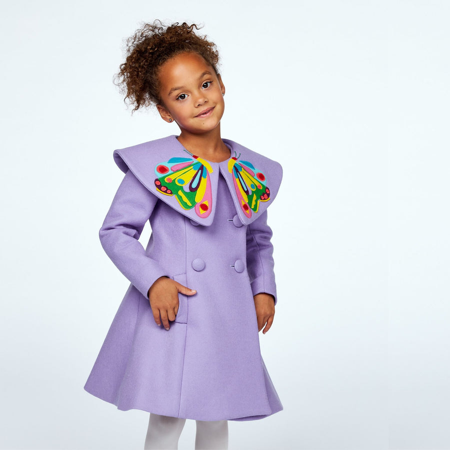 Elegant girls' butterfly coat in purple wool with hand-stitched details and magenta lining